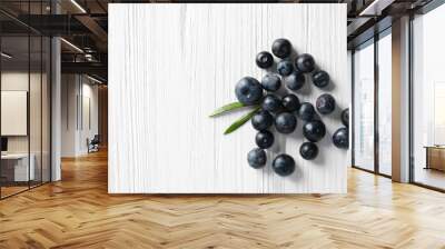 Fresh acai berries on wooden background Wall mural