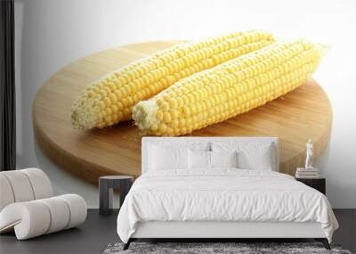 fresh corn on wooden cutting board, isolated on white Wall mural