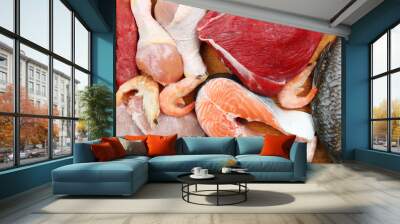 Fresh raw meat products on wooden board Wall mural