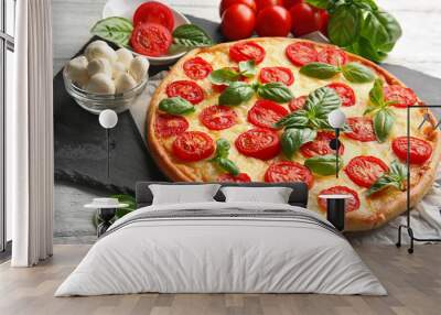 Fresh tasty pizza Margarita on slate plate, closeup Wall mural