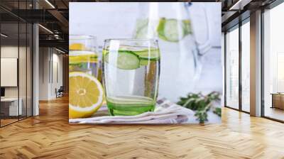 Fresh water with lemon and cucumber in glassware Wall mural