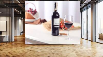 Glass of wine with food on blurred background Wall mural