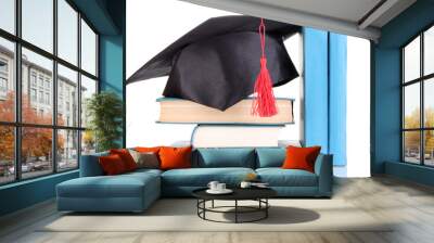 Grad hat with books isolated on white Wall mural