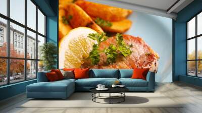 Grilled steak, vegetables and fried potato pieces on plate and space for text Wall mural