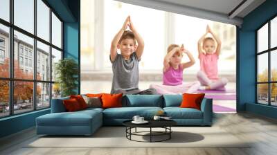 Group of children doing gymnastic exercises Wall mural