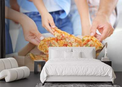 Hands taking pizza from table, closeup Wall mural