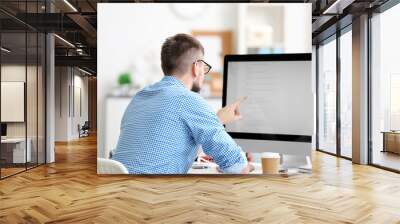 handsome young programmer working in office Wall mural