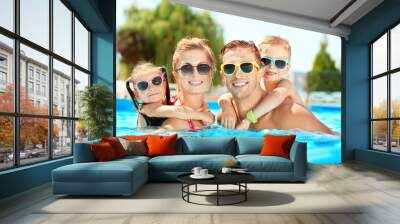 Happy family in swimming pool at water park Wall mural