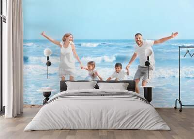 Happy family on sea beach at resort Wall mural