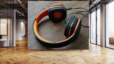 Headphones on wooden background Wall mural