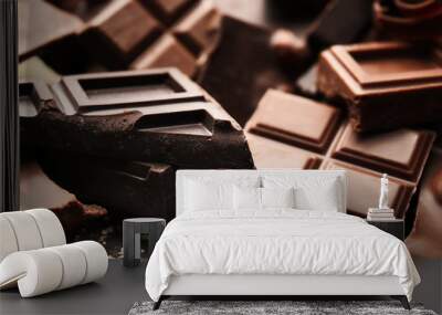 Heap of broken chocolate pieces, close up Wall mural