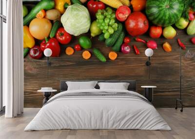 Heap of fruits and vegetables on wooden background Wall mural