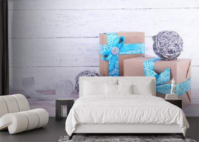 Holiday gift boxes decorated with blue ribbon Wall mural