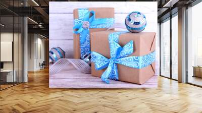 Holiday gift boxes decorated with blue ribbon Wall mural