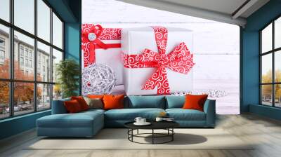 Holiday gift boxes decorated with red ribbon Wall mural