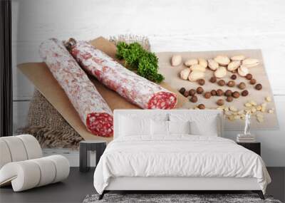 Italian salami on plate,  on wooden background Wall mural