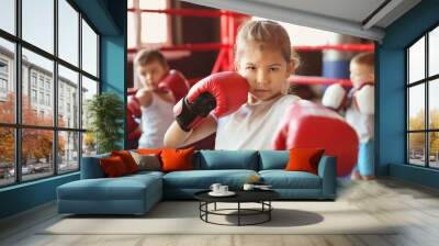 Little girl in boxing gloves on ring Wall mural