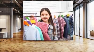 little girl trying on a new dress Wall mural