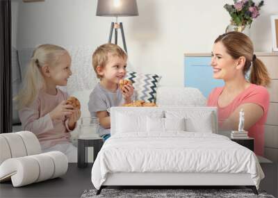 Little kids with their mother at home Wall mural