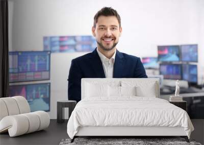 Male stock trader working in office Wall mural