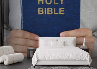 Man holding Bible close up Wall mural