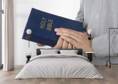 Man holding Bible isolated on white Wall mural