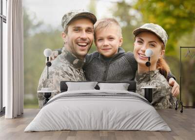 Military family reunited on a sunny day Wall mural