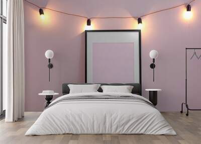 Mockup of blank frame with garland on light background Wall mural