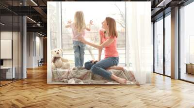 mother and daughter near window in room Wall mural