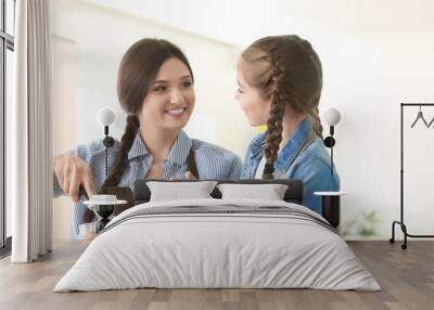 Mother and daughter preparing dough indoors Wall mural