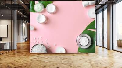 Natural cosmetics and leaves on pink background Wall mural