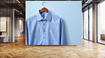 New male shirt on blue background Wall mural