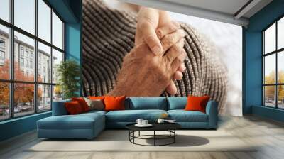 Old male and young female hands, closeup Wall mural