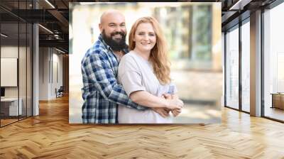 Overweight couple on city street Wall mural