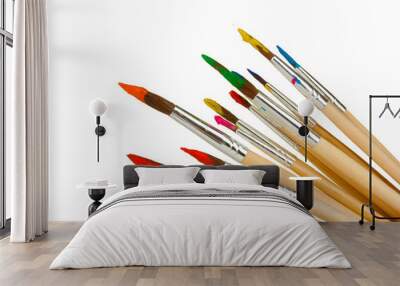 Paint brushes with gouache isolated on white Wall mural