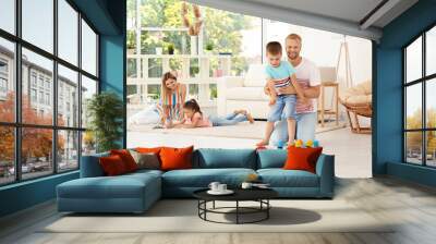 Parents spending time with children at home Wall mural