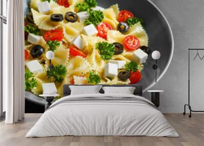 Pasta salad with tomatoes and cheese on table Wall mural