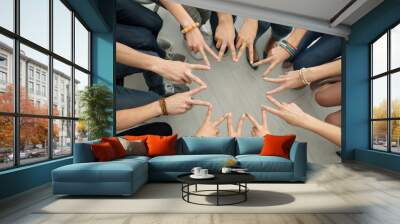 People putting hands together as symbol of unity Wall mural