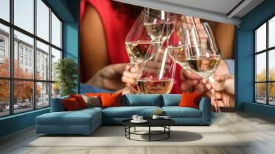 People toasting with glasses of white wine, closeup Wall mural