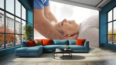 Physiotherapist working with elderly patient in clinic, closeup Wall mural