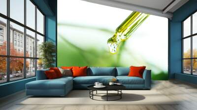 pipette with essential liquid, closeup Wall mural