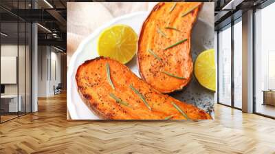 Plate with cooked sweet potato on table Wall mural