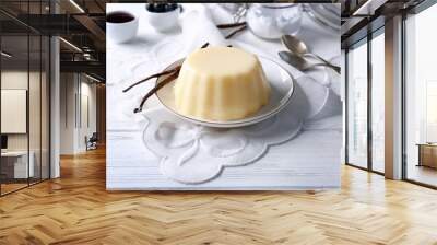 Plate with delicious vanilla pudding on wooden table Wall mural