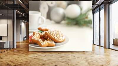 plate with tasty gingerbread cookies on table, close up view Wall mural