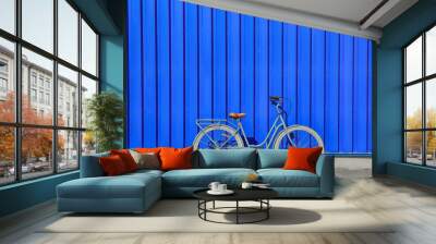 Retro bicycle near blue wall outdoors Wall mural