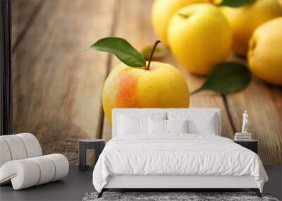 Ripe yellow apple on wooden table Wall mural