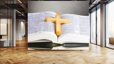 Russian open holy bible with wooden cross on black backround Wall mural