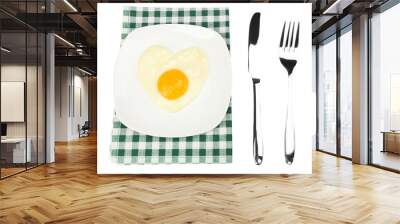 Scrambled eggs with bread on plate, on color napkin Wall mural