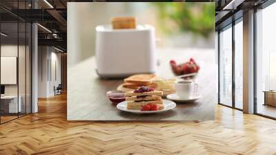 served table for breakfast with toast and jam, on blurred background Wall mural