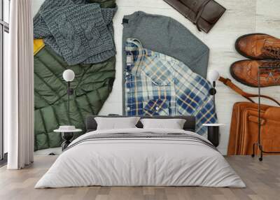 Set of stylish male hipster clothes on wooden background Wall mural